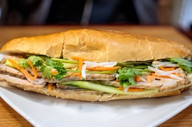 Grilled pork banh mi with pickled carrot, cucumber and cilantro