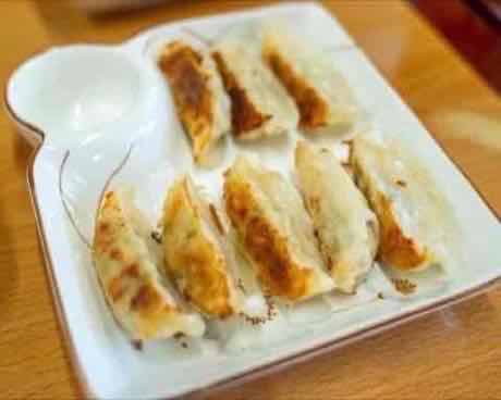 Pan-fried potstickers with crisp golden bottoms