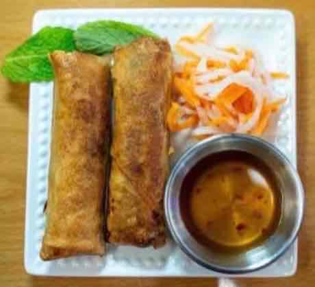 Crispy pork egg rolls with pickled daikon, carrot and dipping sauce