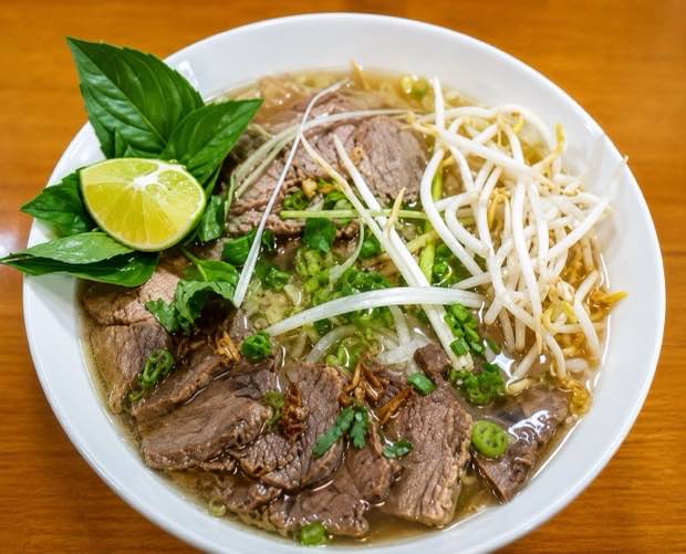 House special beef pho with rare beef, bean sprouts, Thai basil and lime